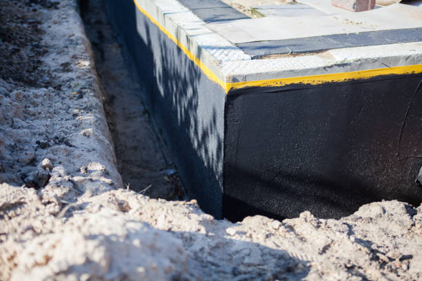 Professional Basement Waterproofing technician working in Taylor, PA